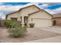Lovely single-story home with desert landscaping and an attached two-car garage at 1170 E Jardin Dr, Casa Grande, AZ 85122