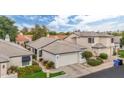 Beautiful aerial shot of a single story home with desert landscaping, a gray tile roof, and a two car garage at 15815 N 4Th Dr, Phoenix, AZ 85023