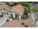 Aerial view of a cozy single-story home with a tile roof and desert landscaping at 15902 W Hearn Rd, Surprise, AZ 85379