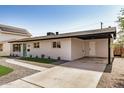 Single-story home with a covered carport and desert-friendly landscaping at 2111 N Van Ness Ave, Tempe, AZ 85288