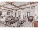 Spacious living area with wood beam ceilings open to kitchen and dining at 23126 N 45Th Pl, Phoenix, AZ 85050