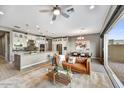 Open-concept layout with spacious kitchen and living area, seamlessly connected with modern finishes and abundant natural light at 25326 N 19Th Dr, Phoenix, AZ 85085