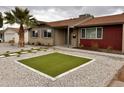 Beautiful home with desert landscaping with cacti and rocks for low maintenance at 3021 E Shangri La Rd, Phoenix, AZ 85028