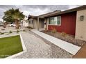 Beautiful home with desert landscaping with cacti and rocks for low maintenance at 3021 E Shangri La Rd, Phoenix, AZ 85028