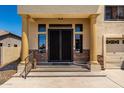 Elegant front entrance with double doors, decorative columns, and stone accents at 3644 E Del Rio St, Gilbert, AZ 85295