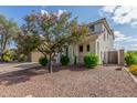 Well-maintained home exterior surrounded by lush landscaping, creating a serene and inviting atmosphere at 4135 E Waterman Ct, Gilbert, AZ 85297