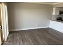 Modern living area features vinyl flooring, neutral walls, and an open layout for a comfortable living space at 4750 N Central Ave # A10, Phoenix, AZ 85012