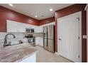 Modern kitchen featuring stainless steel appliances, granite counters and white cabinets at 10371 W Pontiac Dr, Peoria, AZ 85382