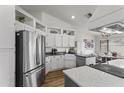 Stylish kitchen featuring white cabinetry, stainless steel appliances, and an open layout at 10733 W Clover Way, Avondale, AZ 85392