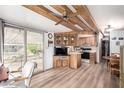 Eat in kitchen with ceiling fan, wood cabinets and sliding glass doors at 111 S Greenfield Rd # 119, Mesa, AZ 85206