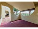 Red painted covered patio showcasing archway architectural detail at 131 N Higley Rd # 51, Mesa, AZ 85205