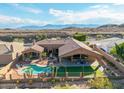 Expansive desert home with a fenced pool, back patio, desert landscaping, and mountain views at 14841 S 6Th Pl, Phoenix, AZ 85048