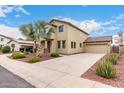 Suburban home with well-maintained landscaping, a detached garage, and a spacious driveway, providing ample parking at 18096 N Arbor Dr, Maricopa, AZ 85138