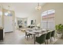 Bright dining room with modern table set and large windows, creating an inviting atmosphere for meals at 20734 N 38Th St, Phoenix, AZ 85050