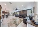 Open-concept living room with an accent wall, plush seating, and stylish decor at 22282 N 184Th Ln, Surprise, AZ 85387
