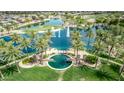Stunning aerial view of the community pool, golf course, and picturesque landscaping at 22683 N Aaron Rd, Maricopa, AZ 85138