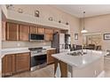 Well-equipped kitchen featuring stainless steel appliances, granite counters, and ample cabinet space at 22683 N Aaron Rd, Maricopa, AZ 85138