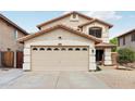 Spacious two-car garage with decorative windows and ample driveway space in front of house at 2306 E Parkside Ln, Phoenix, AZ 85024
