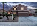 Attractive home featuring rock landscaping, a wide driveway, and a well-maintained facade at 3488 N Lady Lake Ln, Casa Grande, AZ 85122