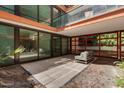 Private outdoor patio area with tiled flooring and comfortable seating, great for relaxation at 4808 N 24Th St # 231, Phoenix, AZ 85016