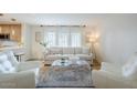 Cozy living room with a plush sofa, transparent coffee table, and bright natural light from large windows at 5201 N 24Th St # 107, Phoenix, AZ 85016