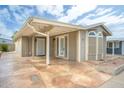 Charming exterior of home with a convenient covered parking space and inviting facade at 5735 E Mcdowell Rd # 67, Mesa, AZ 85215