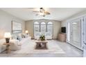Bright living room featuring stylish decor and plenty of natural light from the windows at 5735 E Mcdowell Rd # 67, Mesa, AZ 85215