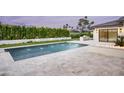 Beautiful pool area with fountains, travertine tile and fire feature, great for outdoor relaxation at 6614 E North Ln, Paradise Valley, AZ 85253