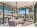 Inviting dining area featuring a modern chandelier, views and sleek dining table at 7120 E Kierland Blvd # 507, Scottsdale, AZ 85254