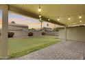 Cozy backyard patio and grassy area, perfect for entertaining at 7624 E Plata Ave, Mesa, AZ 85212
