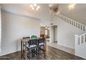 Dining Area with a dark wood floor and a stairwell leading upstairs at 7624 E Plata Ave, Mesa, AZ 85212