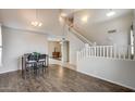 Open concept entryway that includes a dining area, staircase and views to other rooms at 7624 E Plata Ave, Mesa, AZ 85212