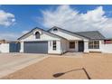 Charming single-story home with a two-car garage, gravel landscaping, and a well-maintained front yard at 10358 N 78Th Ave, Peoria, AZ 85345