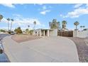 Beautiful home exterior featuring desert landscaping and a circular driveway at 10619 N 38Th Ave, Phoenix, AZ 85029