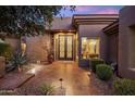 Elegant double iron doors and well-manicured landscaping at front entrance at 15135 E Sundown Dr, Fountain Hills, AZ 85268