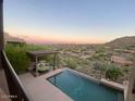 Resort-style pool with an outdoor lounge area showcasing desert landscaping and mountain views in the background at 15135 E Sundown Dr, Fountain Hills, AZ 85268