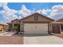 Single-Gathering home with a 2-car garage, desert landscaping, and an inviting front entrance at 15633 W Acapulco Ln, Surprise, AZ 85379