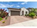 Charming single-story home featuring a two-car garage and a well-maintained, drought-resistant landscaped front yard at 18422 W Clinton St, Surprise, AZ 85388