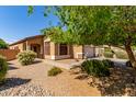Inviting single-Gathering home with desert landscaping, a two-car garage, and a covered front entry at 2140 S Benton Cir, Mesa, AZ 85209