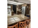 Kitchen featuring granite countertops, stainless steel appliances, and dark wood cabinets at 2232 E Inglewood St, Mesa, AZ 85213
