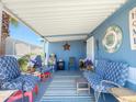 Inviting covered porch with comfortable seating, perfect for relaxing and enjoying the outdoors at 3104 E Broadway Rd # 212, Mesa, AZ 85204