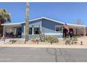 Attractive single-story home featuring low-maintenance desert landscaping and a covered porch at 3104 E Broadway Rd # 212, Mesa, AZ 85204