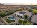 Beautiful desert home with large pool, spa, fire pit and covered patio at 31703 N 15Th Dr, Phoenix, AZ 85085