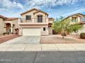 Two-story home featuring a balcony, a two-car garage and low-maintenance desert landscaping at 3421 S 256Th Ave, Buckeye, AZ 85326