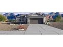 Charming single Gathering home featuring desert landscaping, neutral paint colors, and an attached two car garage at 35566 N Breezy Ln, San Tan Valley, AZ 85140