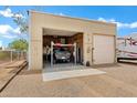 Extra tall garage featuring a car lift, ample storage space and plenty of light at 4187 E Triple Crown Dr, San Tan Valley, AZ 85140