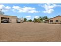 Expansive lot featuring a barn, parking for multiple RV's, with mature landscaping at 4187 E Triple Crown Dr, San Tan Valley, AZ 85140