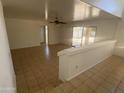 A large living room includes tile floors and access to the backyard at 6416 N 78Th Ln, Glendale, AZ 85303
