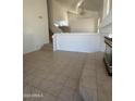 Bright living room boasts tile floors and a grand staircase, perfect for Gathering gatherings at 6416 N 78Th Ln, Glendale, AZ 85303