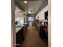 Bright kitchen featuring granite countertops and stainless steel appliances at 6530 W Turney Ave, Phoenix, AZ 85033